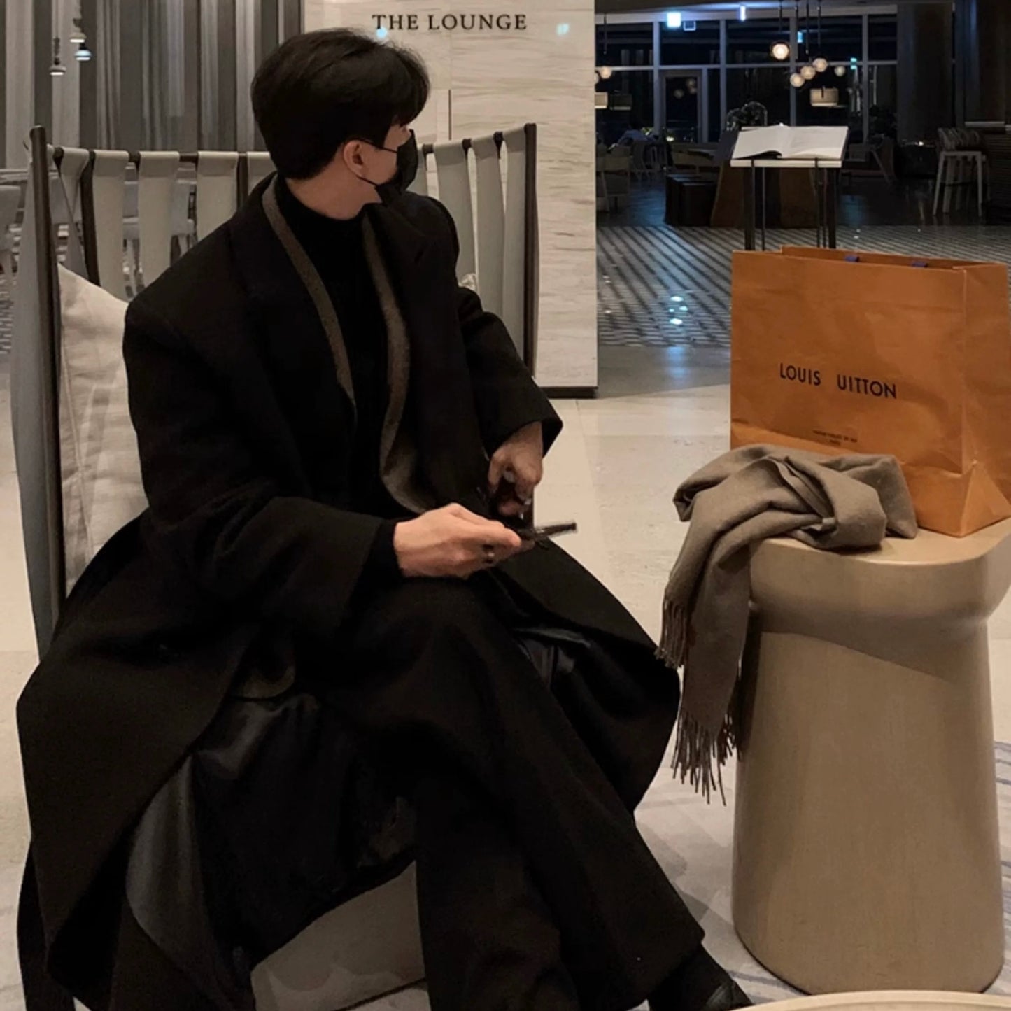 Double-breasted black coat